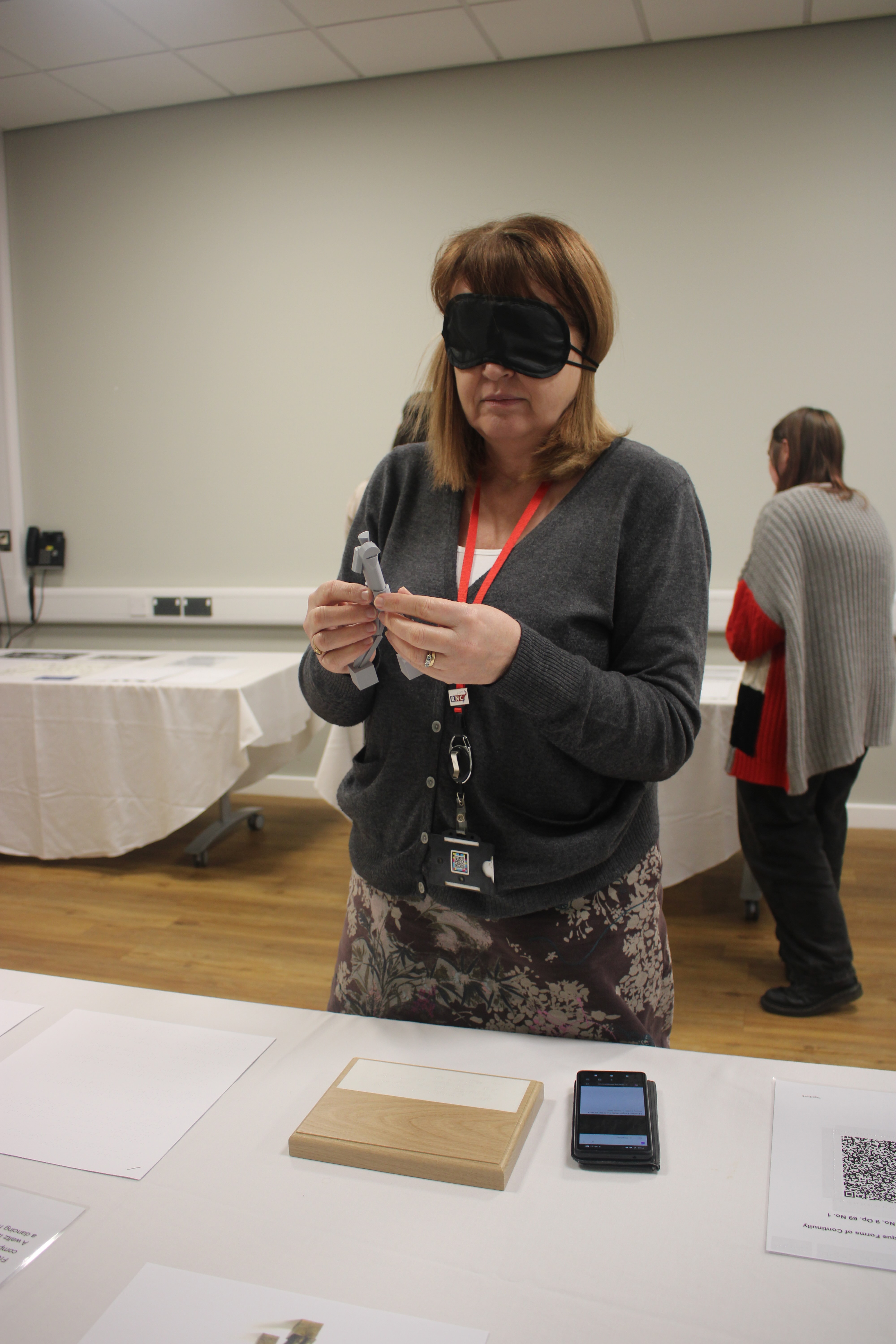 Karen blindfolded explores a 3D model with her hands